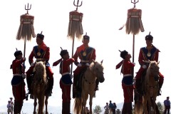 MONGOLIA, Ulaan Baatar, 20000711
Official state horsemen, riding seven white steeds while wearing warrior colors and carrying flags from the time of Ghengis Khan, hand over the ceremonial flags 11July 2000 in Ulaan Baatar, as the whole of Mongolia celebrates the annual Naadam Festival over the next few days.  Over 100 horses raced the 30 kilometer country course, with several horses making it to the finish without their riders.  The origins of the festival, which includes wrestling, horse racing and archery, are rooted in the time period long befor that of Ghengis Khan.  In Mongolian history, Mongols staged feasts to celebrate the birth of an heir to the throne, to bid farewell to warriors prior to a military campaign or to bless weddings and shamanist rituals of ovoo worship.    (ELECTRONIC IMAGE)   AFP PHOTO/Stephen SHAVER