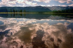 Clouds roll in over northern Mongolia's alpine Khovsgol Lake 08 July 2000, fast becoming the number one attraction in the country. The sacred, pristine lake is the deepest lake in Central Asia and the 14-largest source of fresh water in the world.  The collapse of the Soviet-subsidised economy has forced Mongolians to take a second look at toursim.  The country desperately needs the hard currency which foreign tourism could bring to an economy on its knees.  As the newly elected ex-communists regain power in Mongolia's young democratic government after their landslide victory earlier this month, officials have recognised the vast economic potential of tourism with arrivals up from 25,000 to 100,000 a year.    (ELECTRONIC IMAGE)    AFP PHOTO/Stephen SHAVER